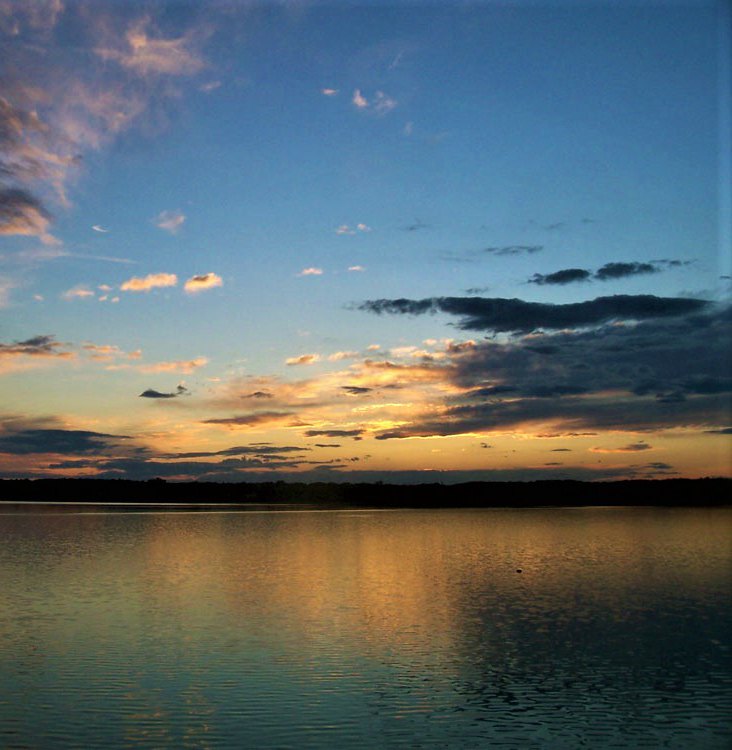 A color photograph of a sunset in Back Cove near Portland, Maine