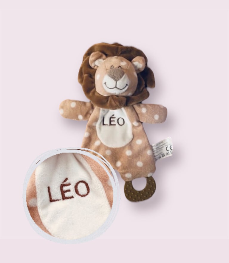 soft toy lion activity dish with brown white polka dots embroidered "Léo"
