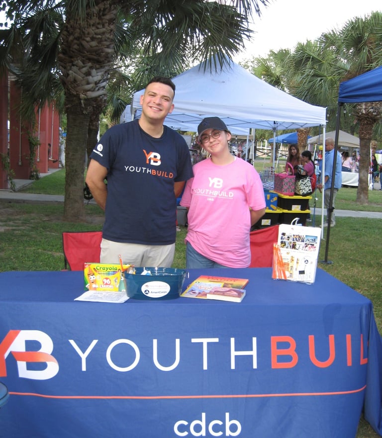 two staff member of youth build by cdcb