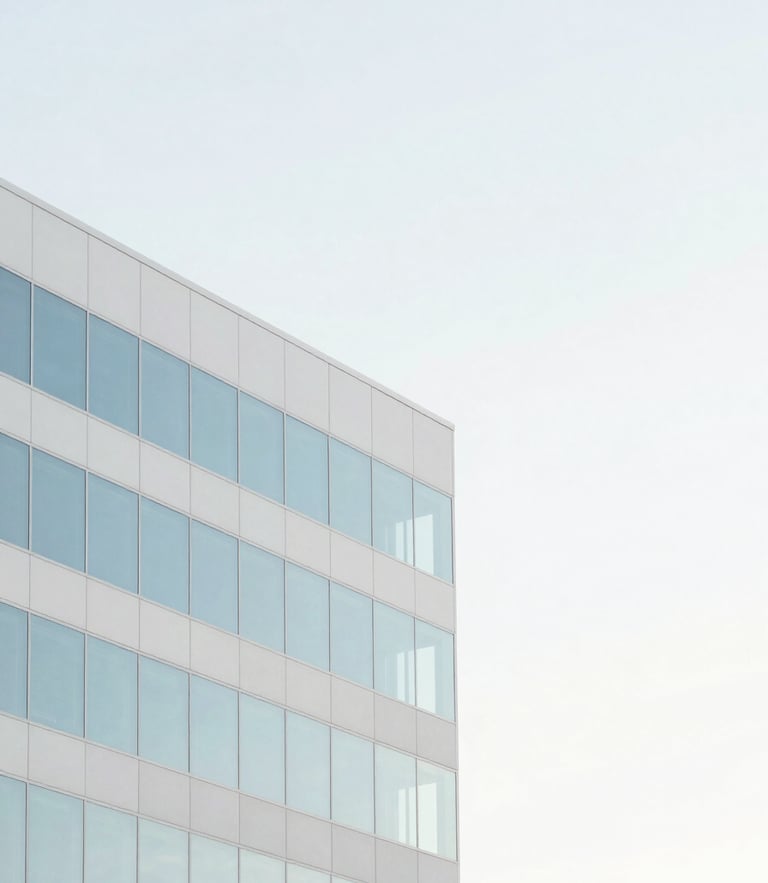 Minimalist architectural detail of a modern Orlando office building, soft morning daylight, high-key pastel sky blue reflections, clean composition with generous negative space.