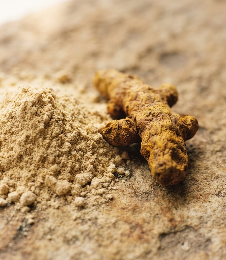 Macro close-up of raw sandalwood powder and turmeric root on a warm textured stone surface, soft morning window light, earthy tones, 35mm