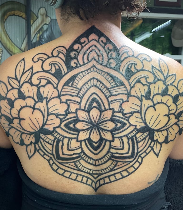 Black work Ornamental backpiece featuring peony flowers
