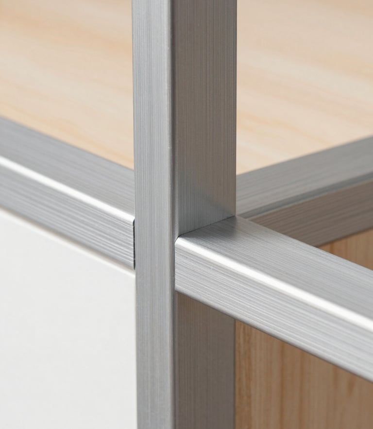 Macro detail shot of a seamless brushed aluminum joint on a modular cabinet frame, sharp focus, clean metallic textures.