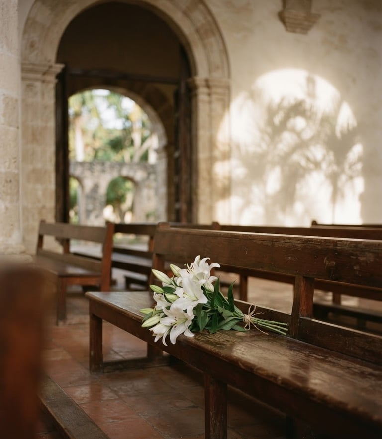 Soft afternoon light filtering through the high arch of a serene chapel, delicate white lilies resting on a polished wooden bench, palm shadows on a warm off-white wall, Dominican Republic.