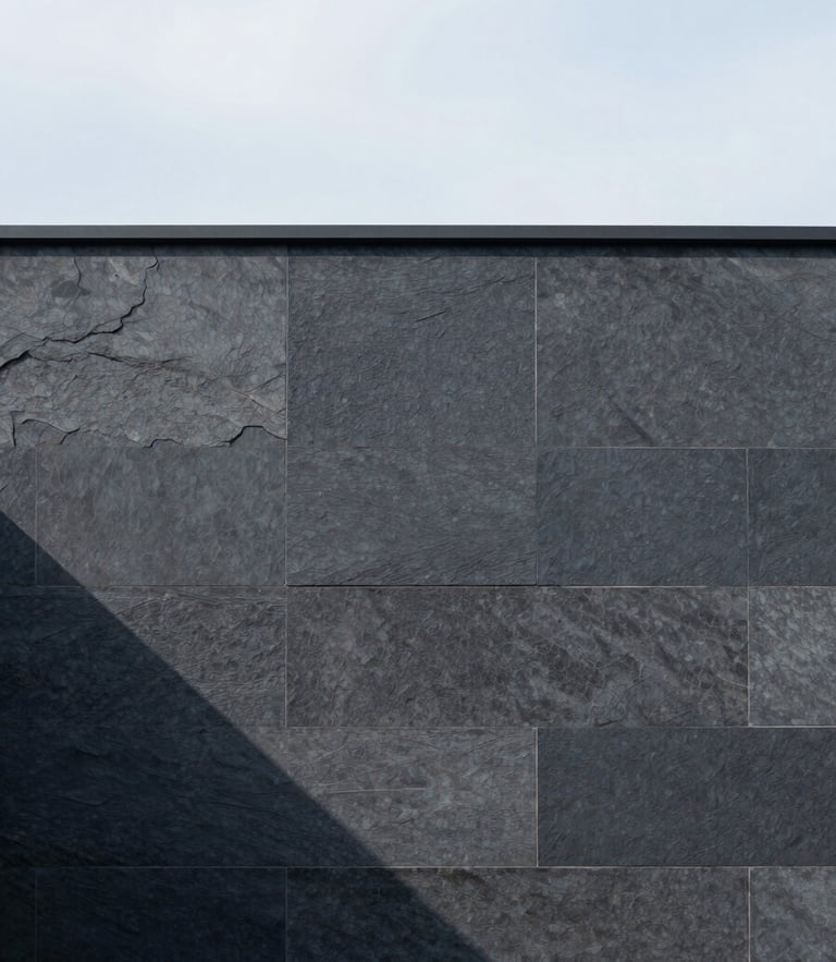 Minimalist architectural detail of a modern stone facade with sharp shadows, soft diffused overcast daylight, muted slate tones, medium format.