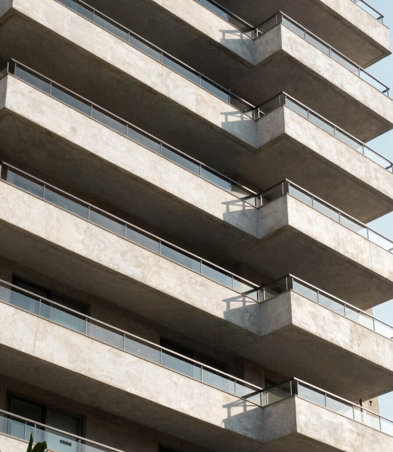 Modern architectural crop of a high-end residential building facade in São Paulo, clean lines, bright natural daylight with sharp geometric shadows.