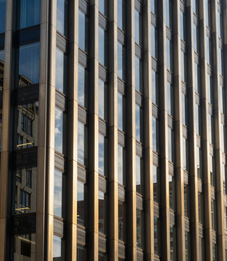 Architectural detail of a modern financial district with high-contrast corporate daylight reflecting off structured glass panels