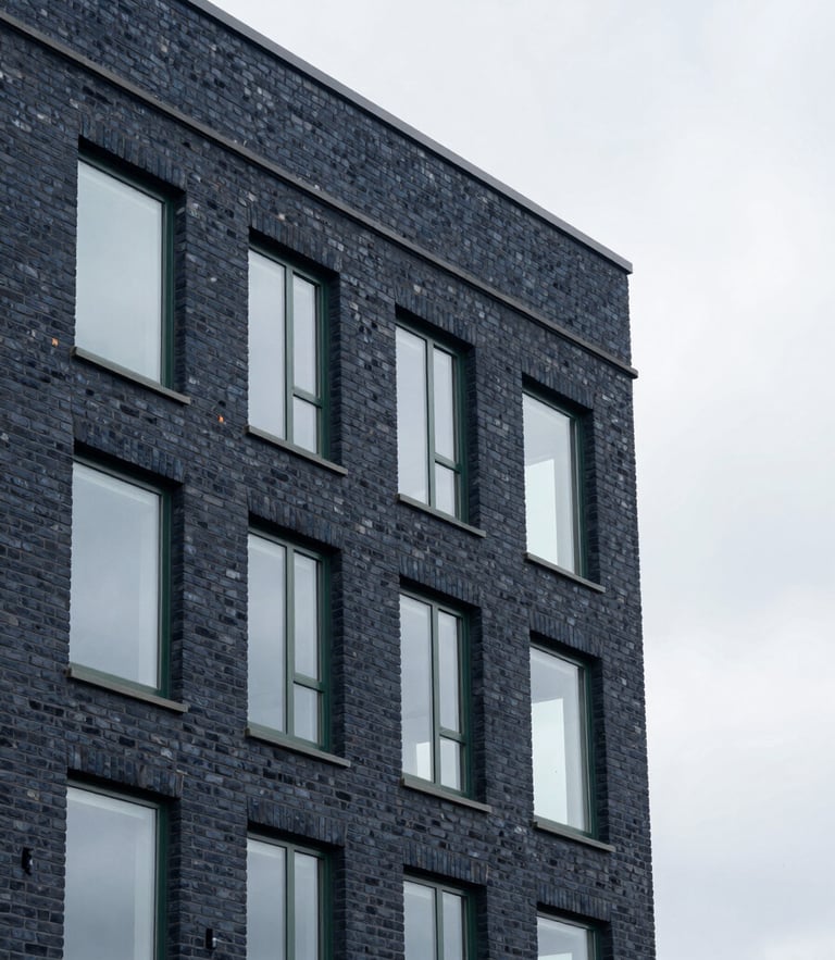 Clean architectural detail of a modern brick office building in Billericay, soft overcast British daylight, sharp focus, 35mm