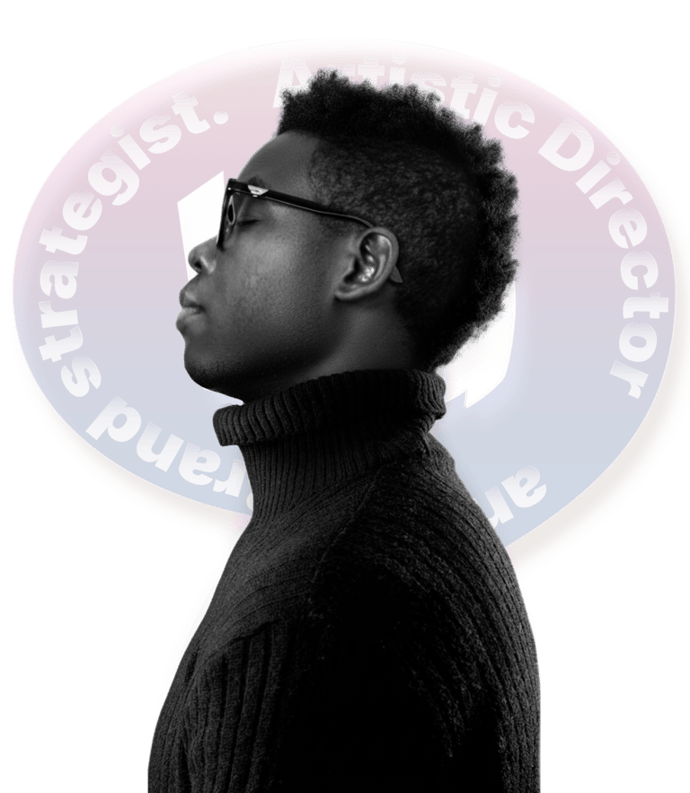 Side profile of a Black male artistic director and brand strategist in a black turtleneck.