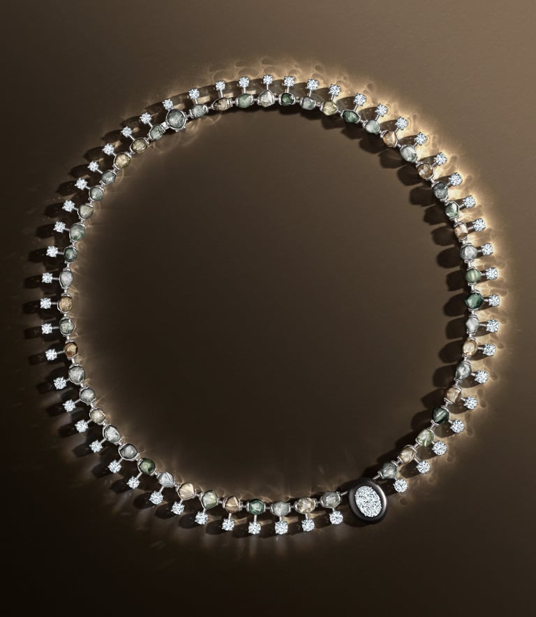 De Beers necklace with diamonds and earthy gemstones.