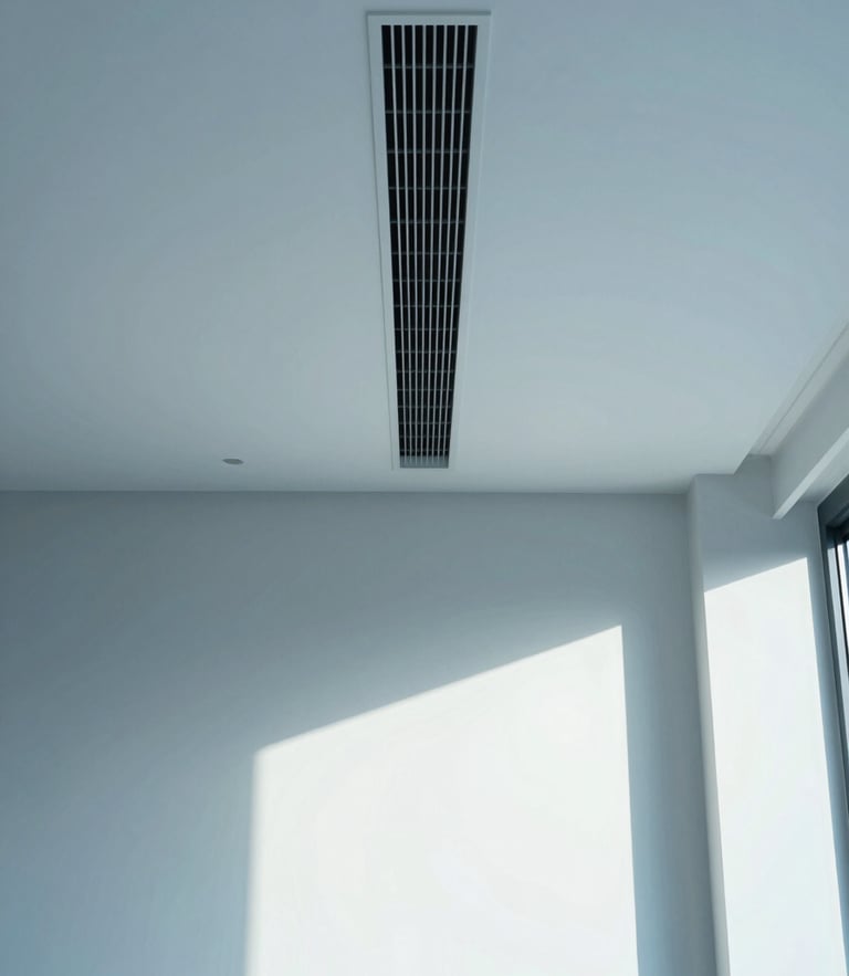 Symmetrical architectural shot of a minimalist luxury living room with an integrated, invisible climate control slot in the ceiling, soft natural side light, cool blue tones, 35mm lens
