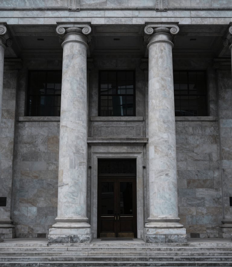 Symmetrical architectural perspective of a neoclassical financial institution facade with clean stone pillars, cool overcast daylight, desaturated navy and slate tones, 35mm