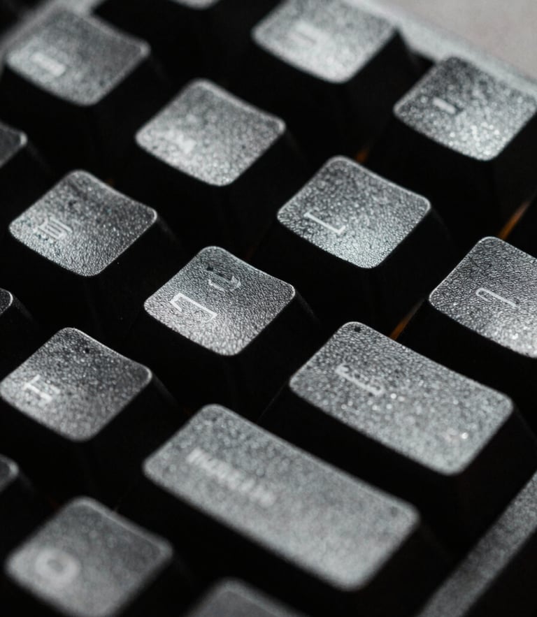 Extreme close-up macro shot of a rugged mechanical keyboard, harsh single-source cold light highlighting textured keycaps, deep black shadows, 35mm film grain.