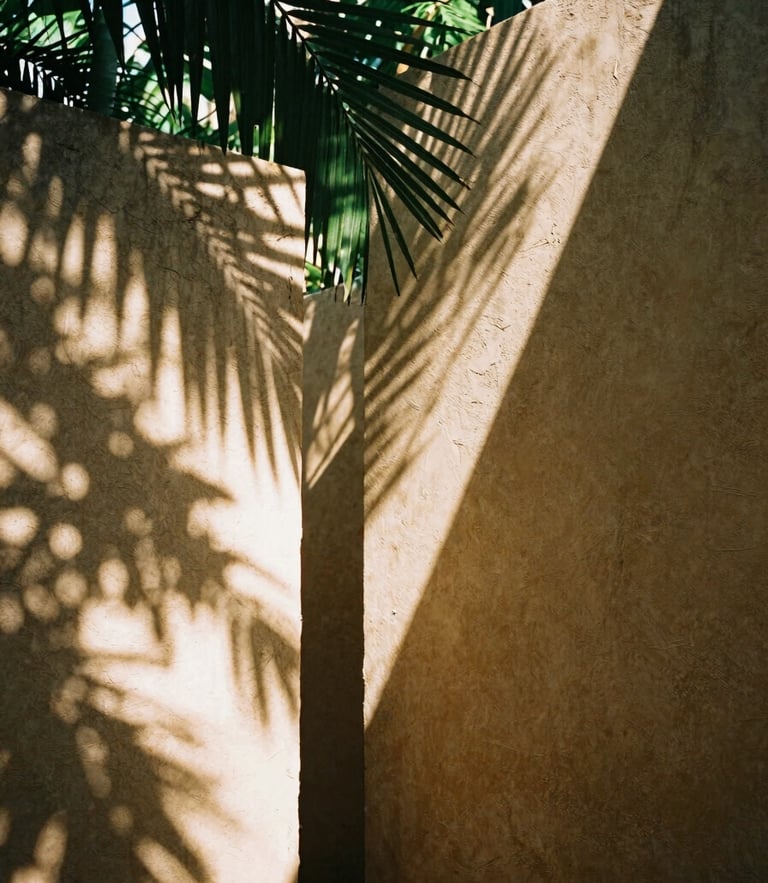 Warm editorial photography, dappled jungle sunlight filtering through palm leaves onto raw chukum walls, 35mm film aesthetic, architectural detail.