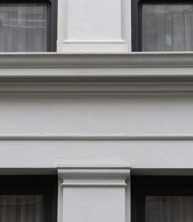 Close-up of clean architectural molding in a renovated historic Brooklyn brownstone, natural overcast light