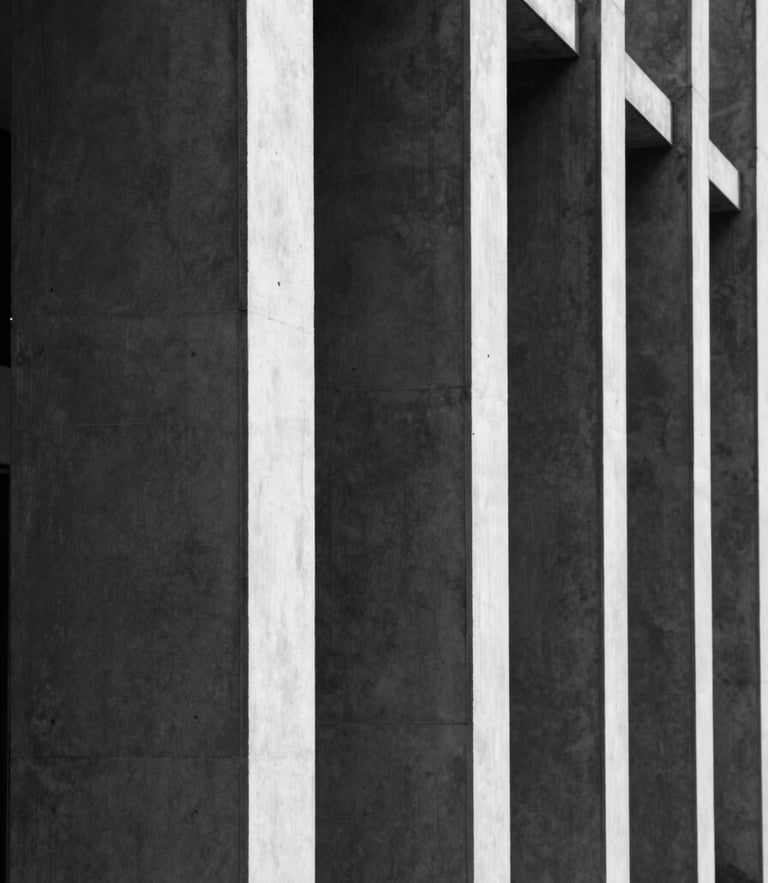 Tight vertical crop of modern concrete and steel architectural columns, stark shadows, high contrast black and white, minimal composition
