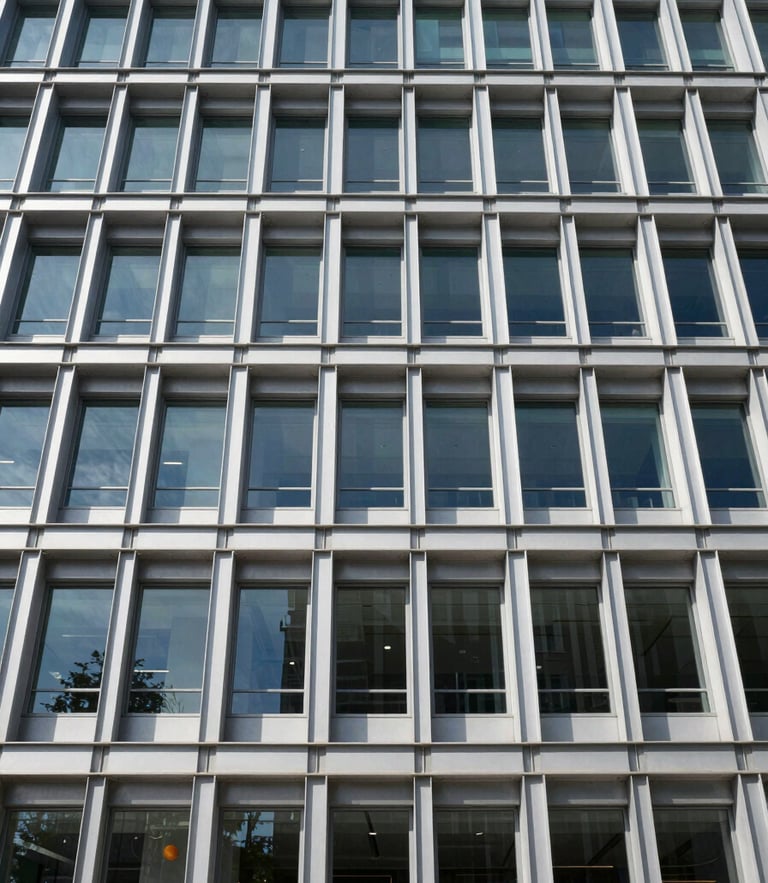 Straight-on architectural elevation of a modern commercial building under crisp daylight, steel framing visible, high contrast geometric shadows