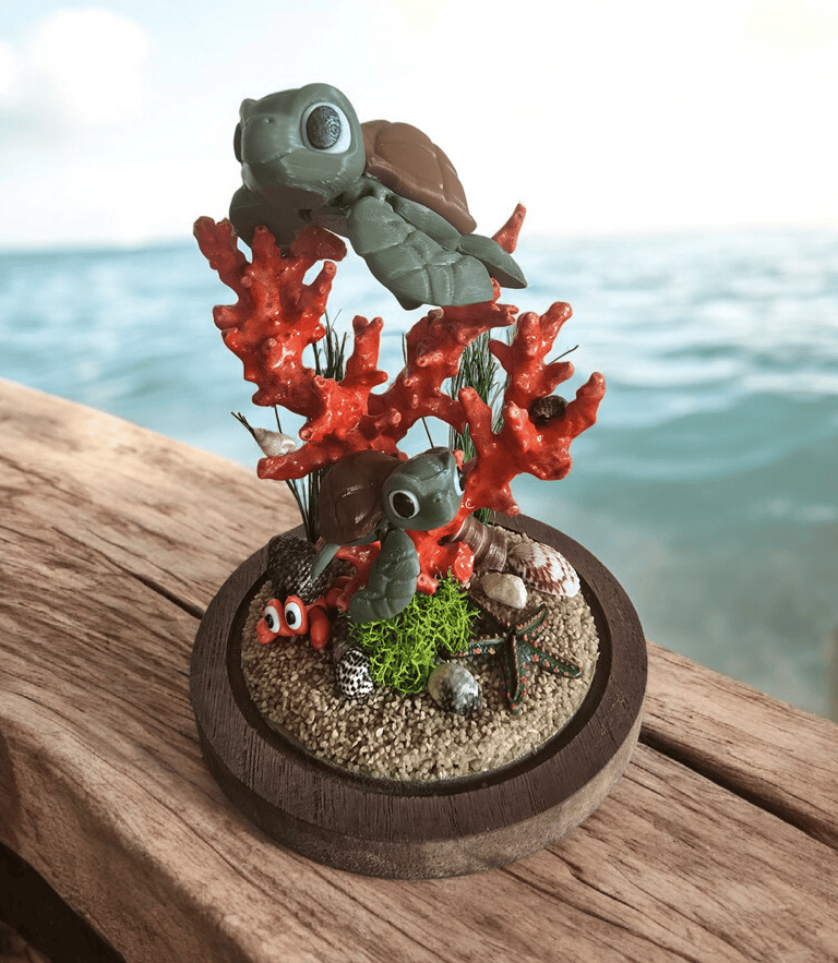 Création artisanale en impression 3D représentant deux tortues marines sur un récif de corail, réali