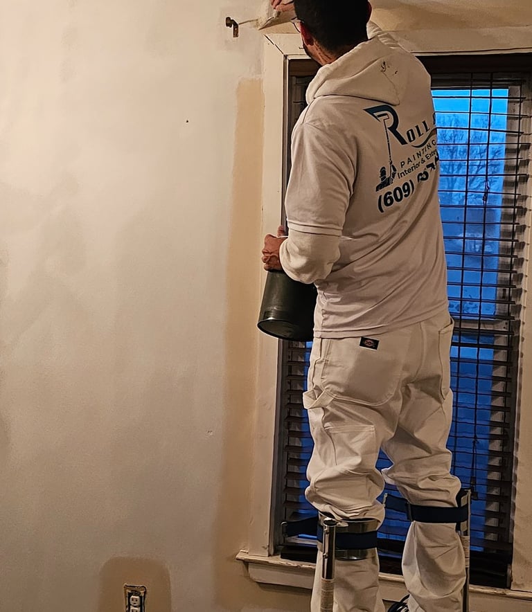 a man painting a wall