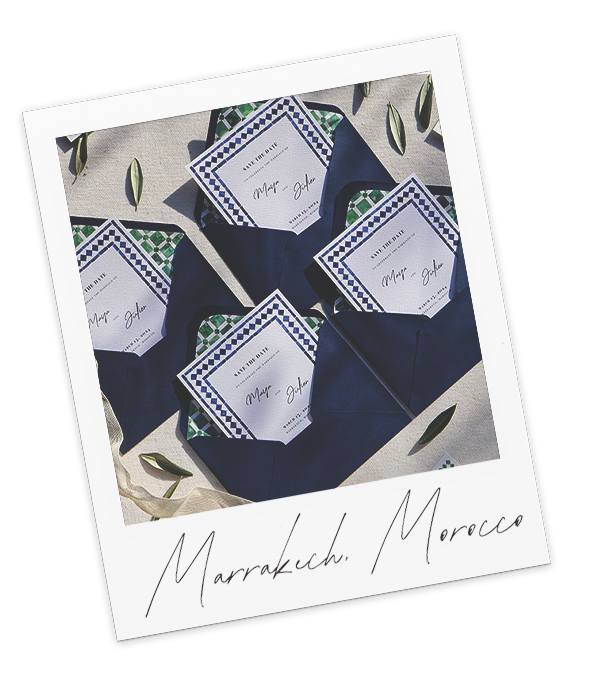 several opened wedding invitations with the invitation inside the open envelope