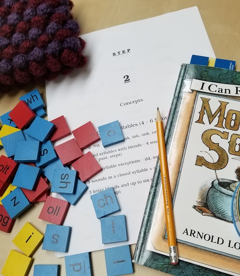 Letter tiles and a "I Can Read!" book.