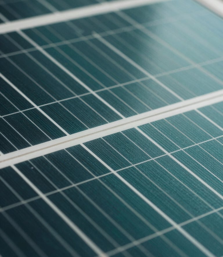 Close-up macro shot of high-efficiency monocrystalline solar cells, showing the intricate grid patterns and metallic textures. Professional lighting emphasizing deep teal and dark green surfaces with a clean, sharp focus.