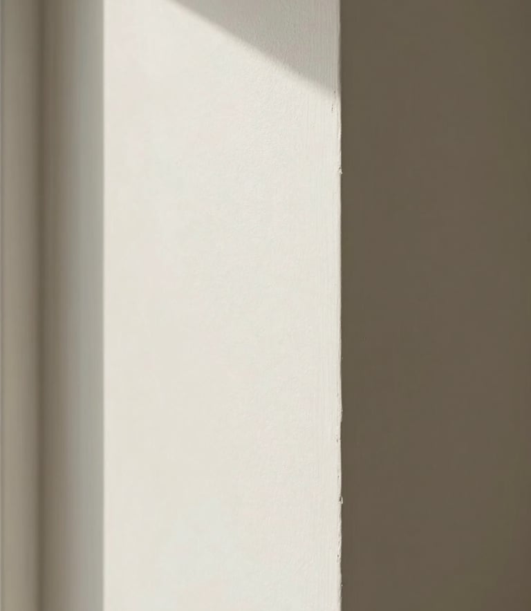 A high-quality photograph showing a finished, smooth off-white drywall corner in a luxury North American / US residential living room. The focus is on the perfectly straight edges and seamless texture under natural morning light.