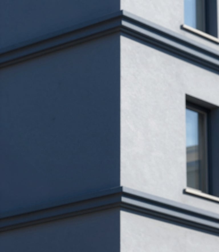 A close-up shot of a perfectly painted modern building facade with sharp lines and professional finish, showcasing dark blue #1E2A3A and light grey #F2F4F7 tones under natural daylight.