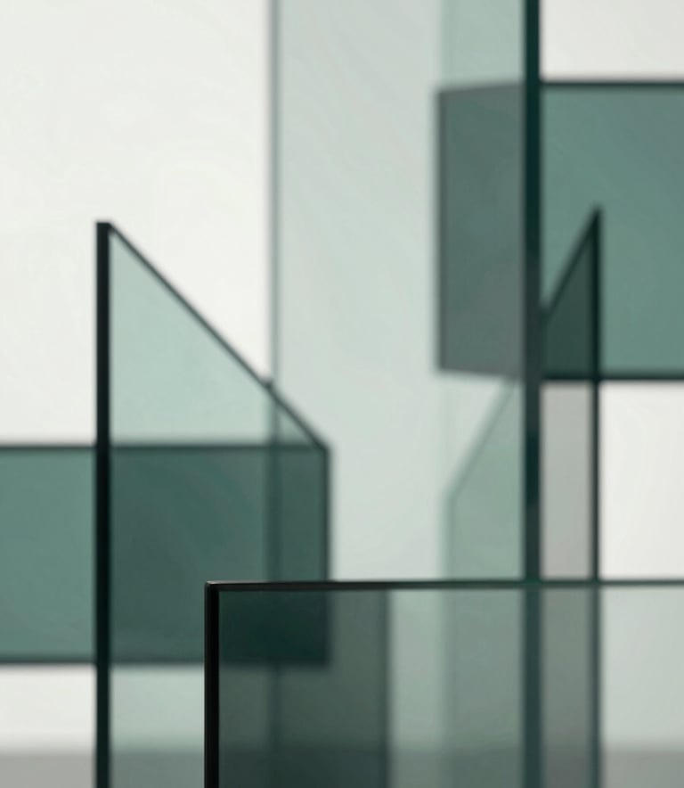 An abstract, sophisticated visualization of growth and structure, featuring geometric glass shapes and light reflections in sage #A9C2C0 and dark teal #1A2E2F tones against a bright background.