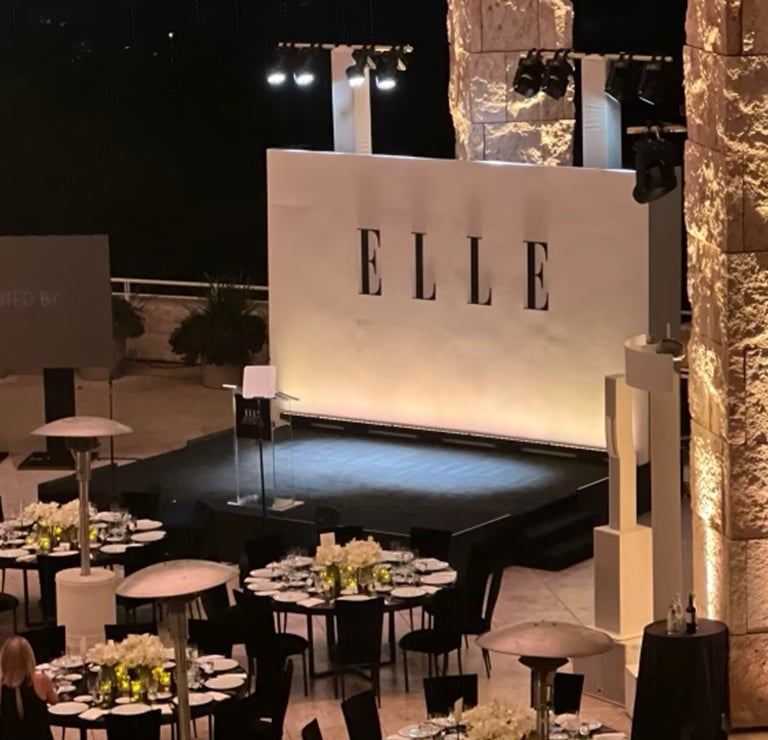 a stage with tables and chairs and a stage