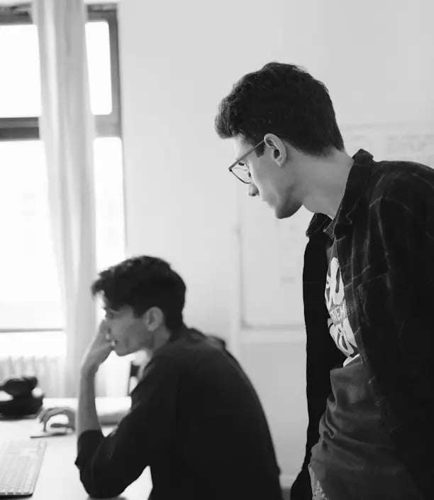 man in black and white plaid dress shirt