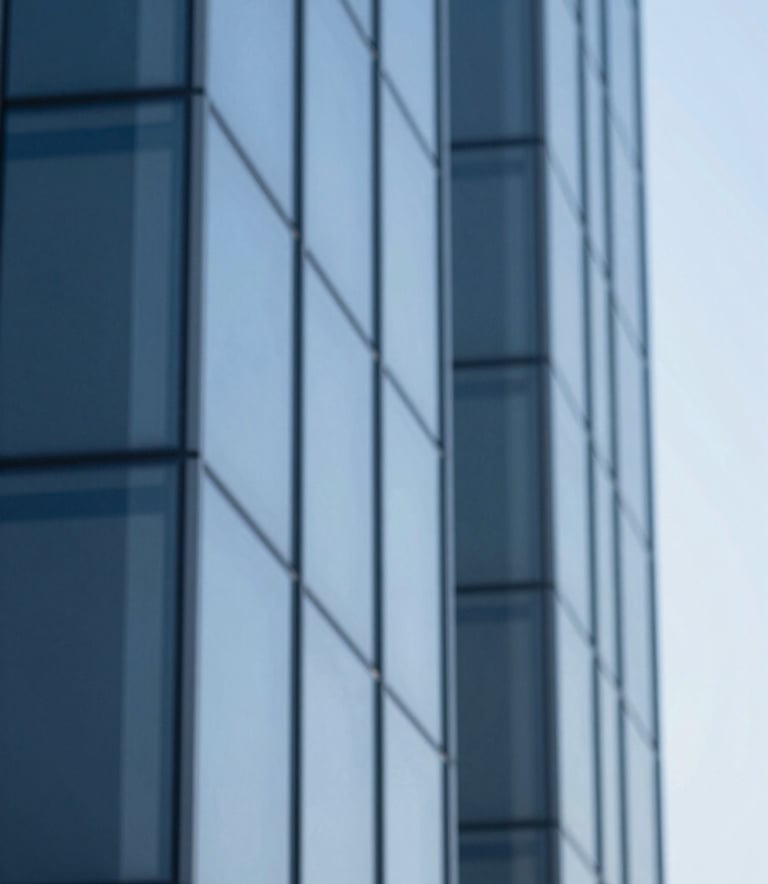 An abstract, sophisticated image of blue glass architectural lines reflecting a clear sky. The colors #4D6A7E and #B0C4D4 are prominent, symbolizing clarity and corporate structure.