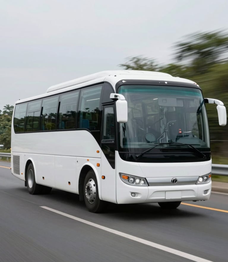 A modern, white charter bus traveling on a wide North American highway with a blurred natural background, emphasizing speed, reliability, and smooth travel. The composition is clean and centered.