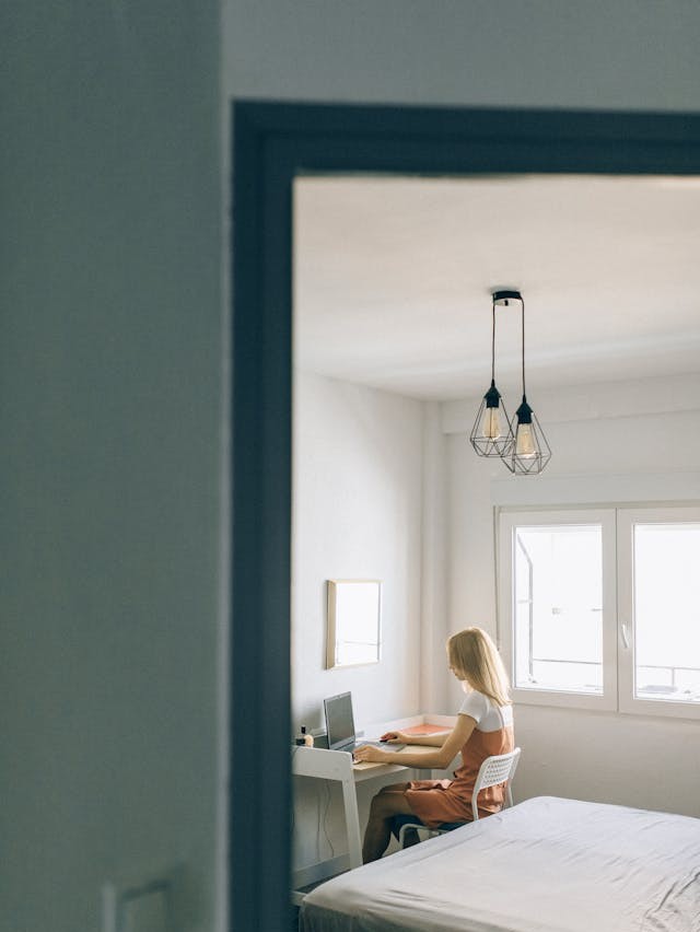 Photo by Nataliya Vaitkevich: https://www.pexels.com/photo/a-woman-sitting-on-a-chair-while-working-