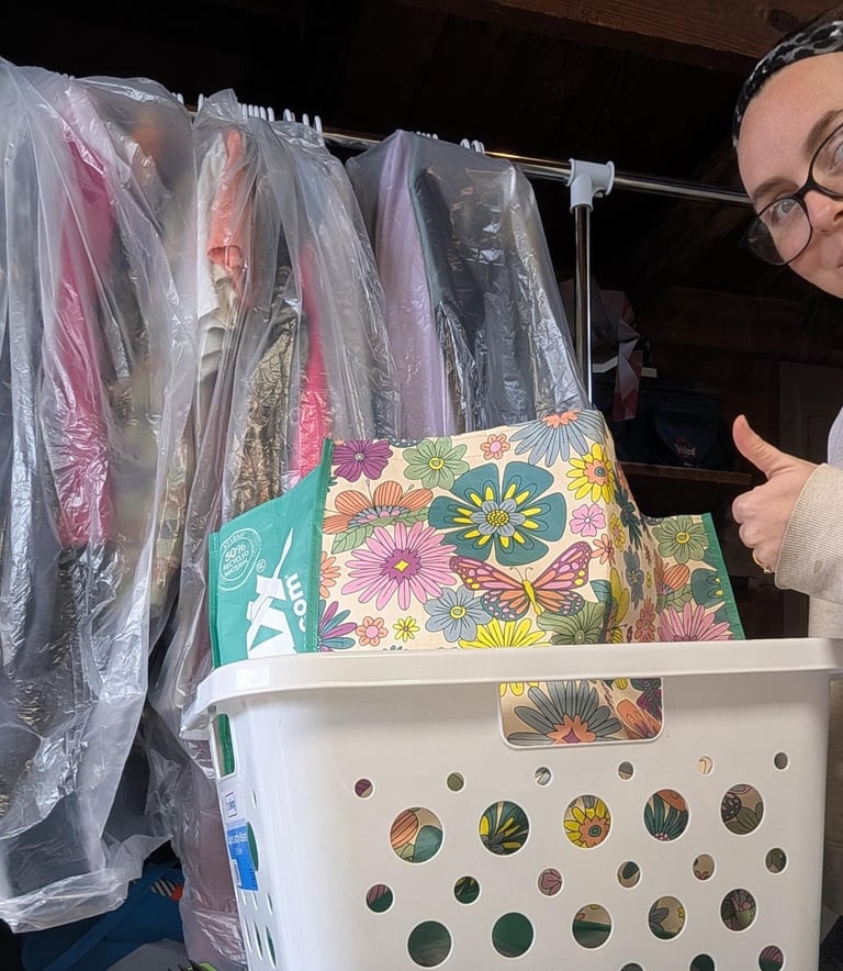 Pickup and delivery laundry service in Athens, AL with freshly cleaned clothes on hangers and folded