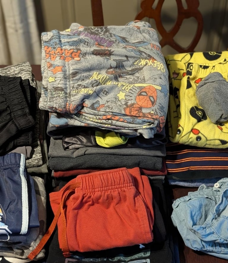 Folded family laundry including kids clothes prepared for wash dry fold service in Athens, AL