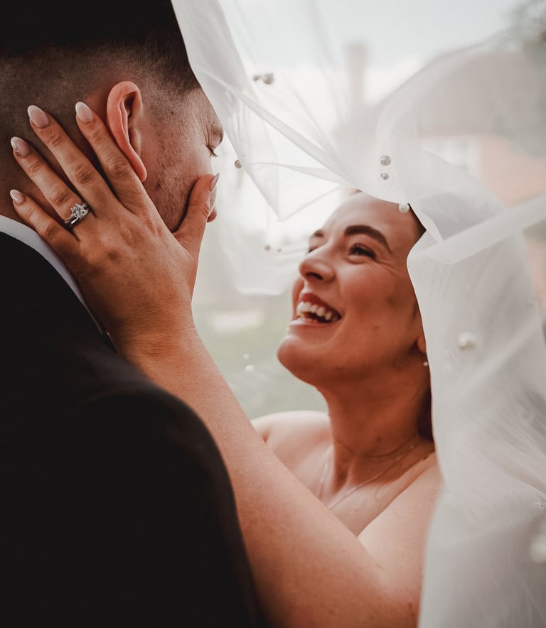 Bride and groom surrounded by friends during celebration in Leeds – wedding photography by The Weddi