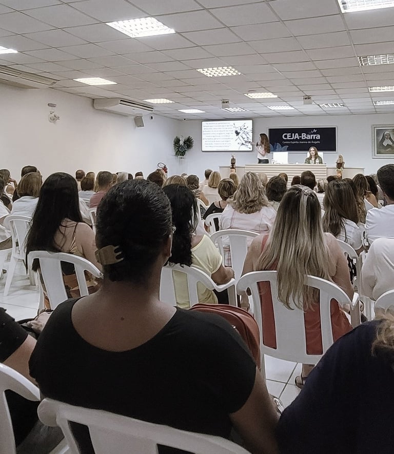 a group of people sitting in chairs in a room