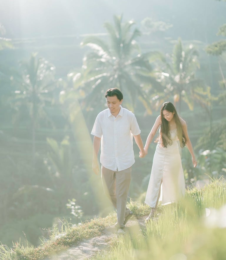 Backlit intimate couple embrace during a sunrise photography session at Tegalalang Ubud Bali.