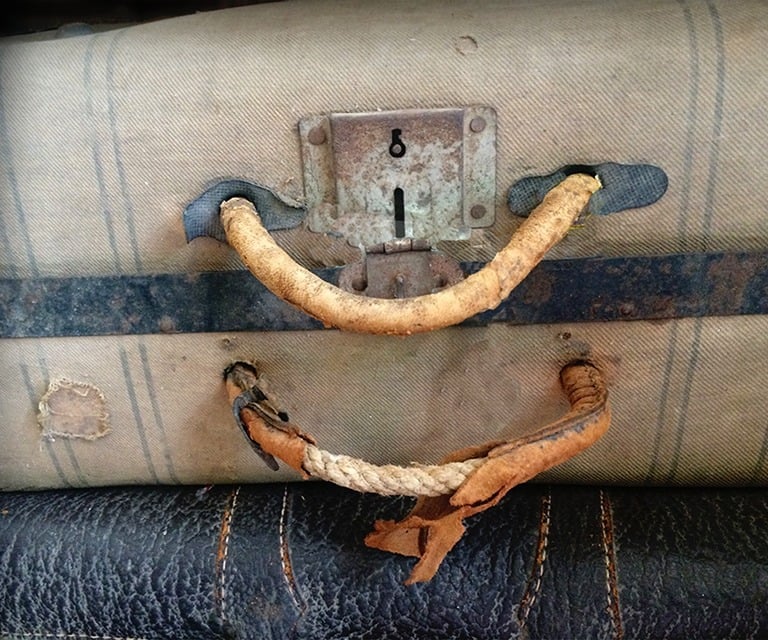 a suitcase with a smile on it
