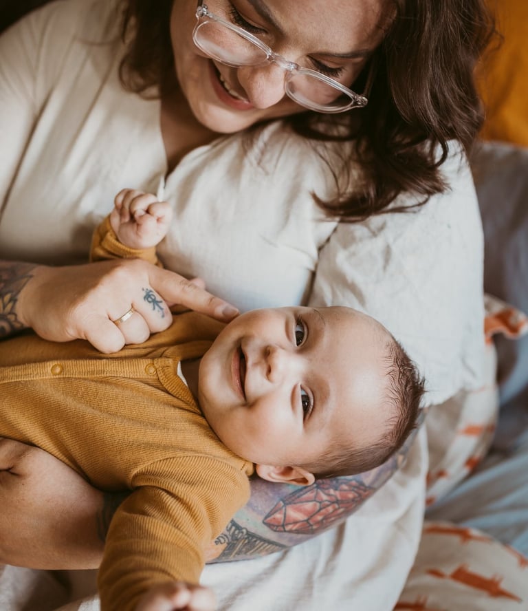 a woman holding a baby in her arms