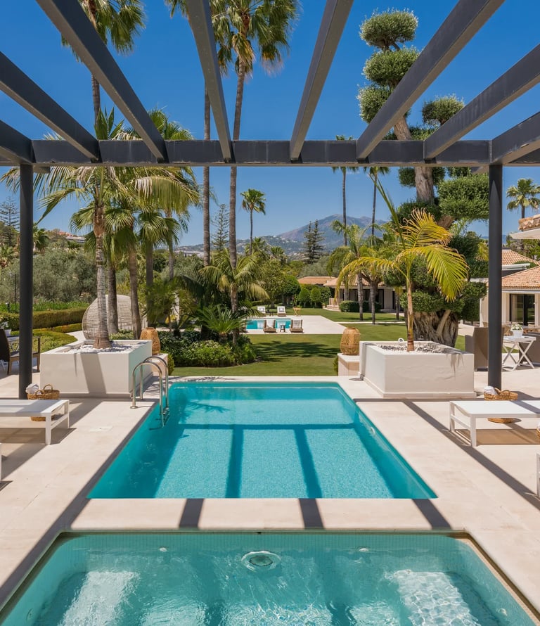 Covered pool terrace with sun loungers