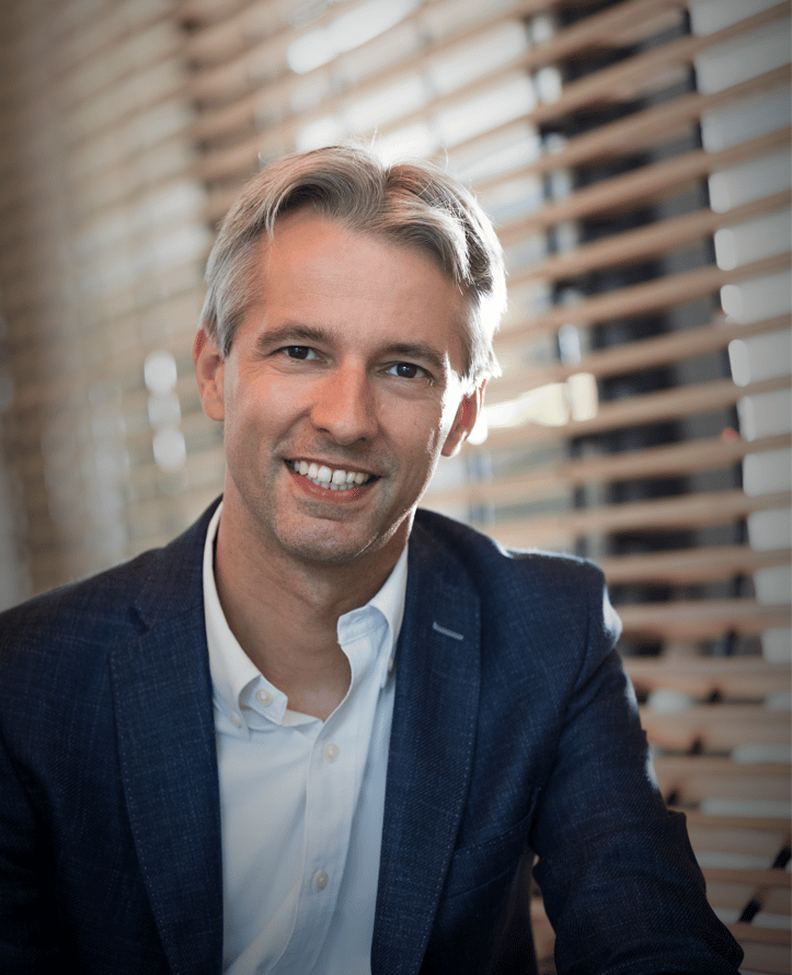 a man in a suit and white shirt