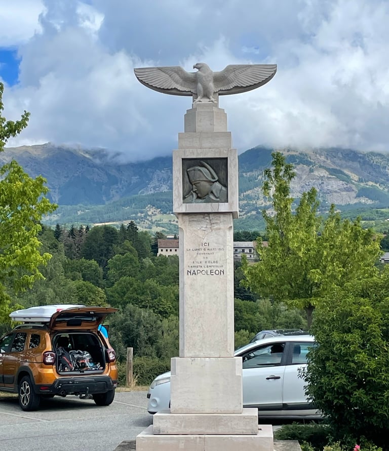 Napoleon route marker in a village along the Naoleon Route, France.