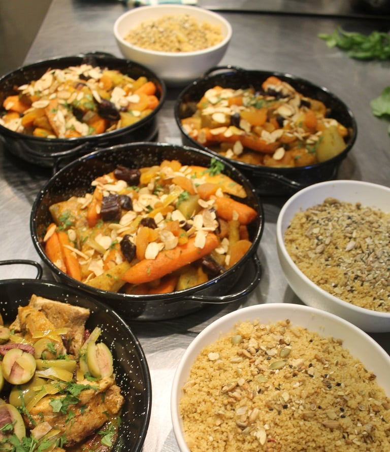 a table with bowls of mediterranean