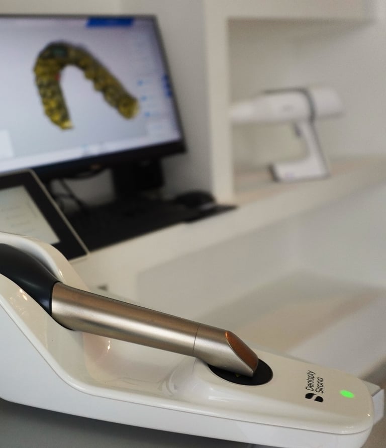 a computer monitor and a laptop on a desk