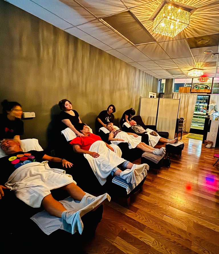 a group of people sitting in a row of chairs