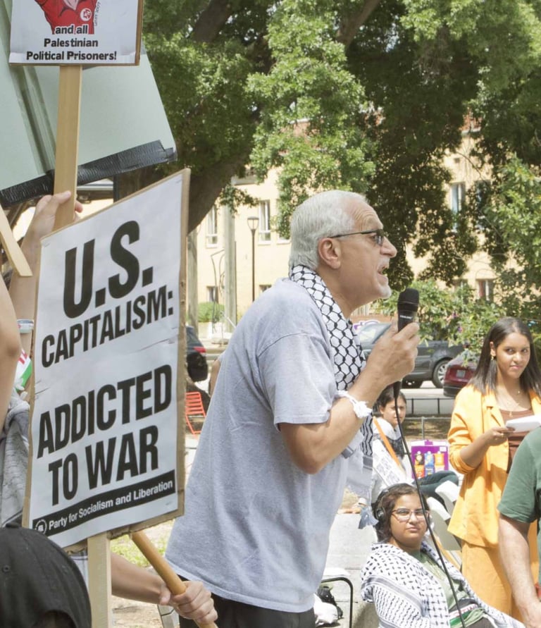 Burhan Ghanayem speaks passionately to a crowd at a protest