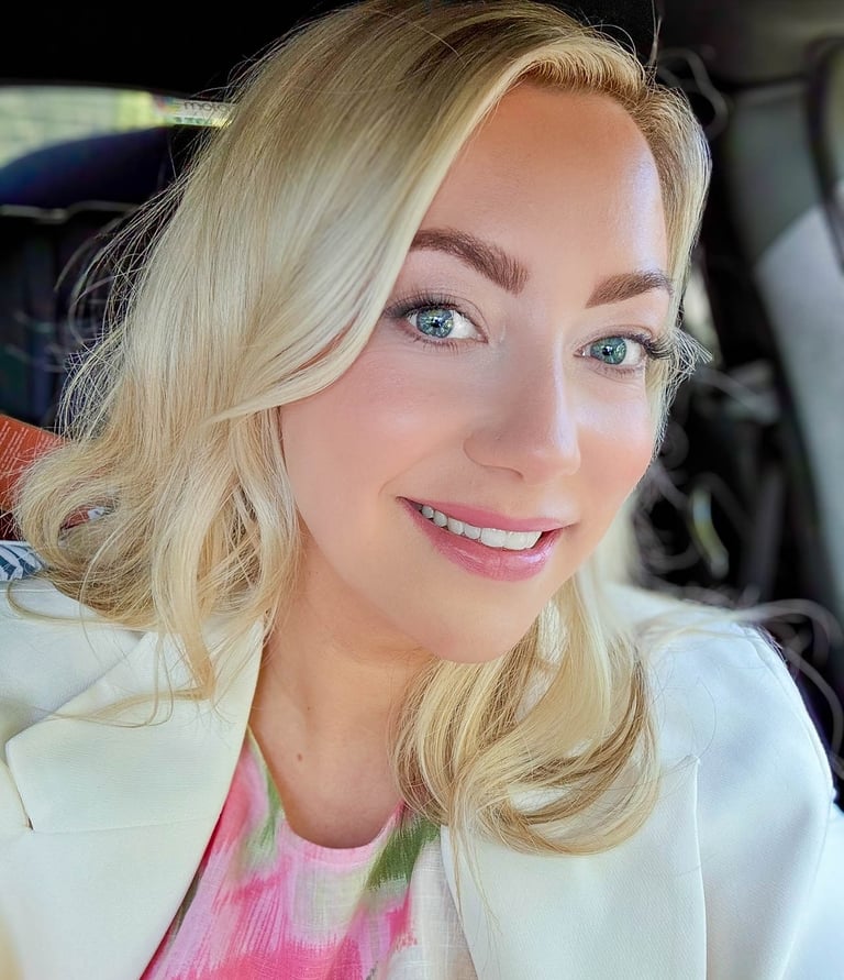 a woman in a white jacket and pink shirt