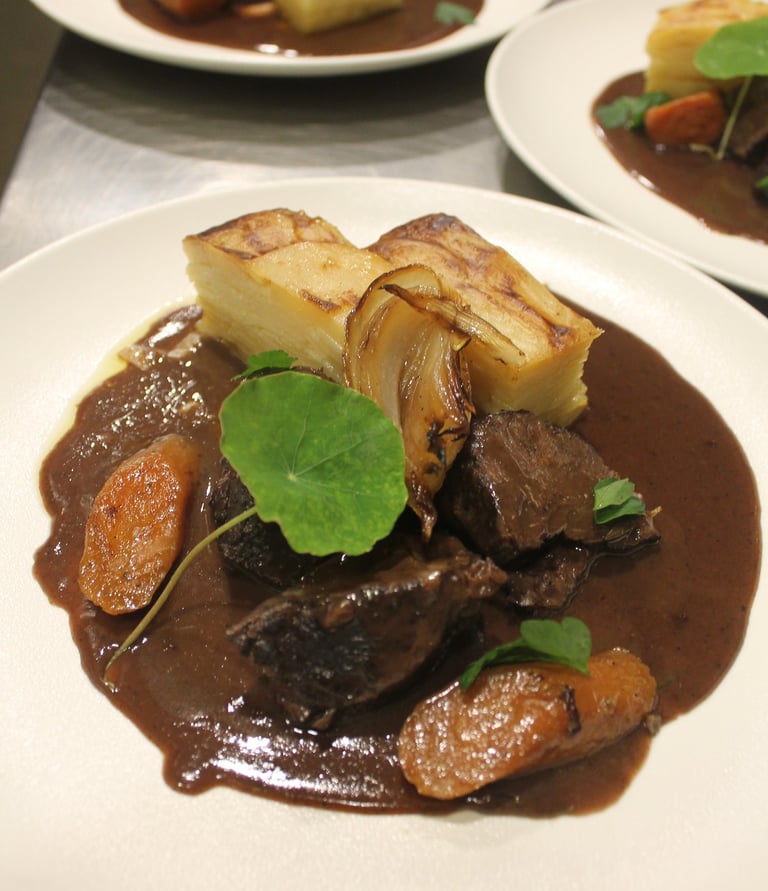 a plate of food with meat and vegetables